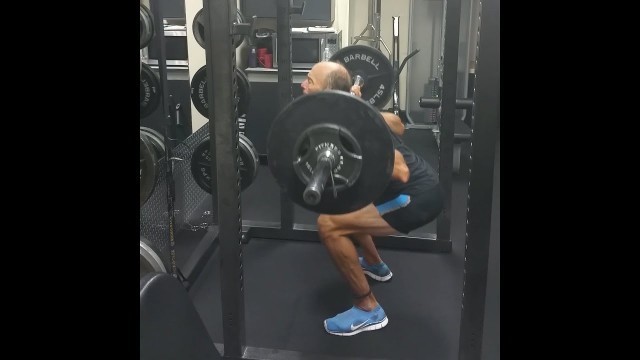 'Dr. Mercola Performs An Overhead Squat Exercise'