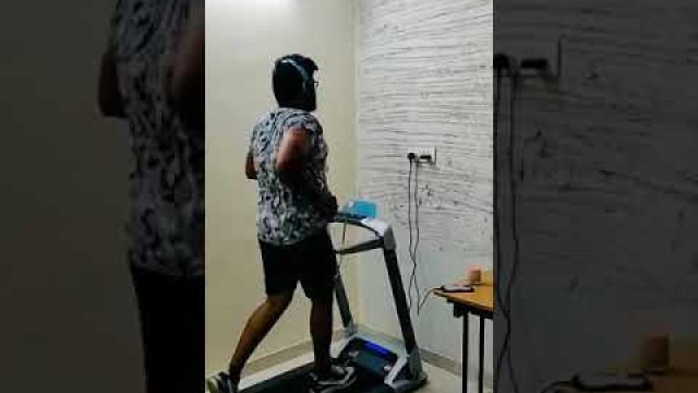 'Running on Powermax Fitness UrbanTrek TD-M4 - (2.0HP) Treadmill with Android & iOS App Treadmill'